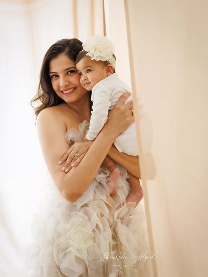 A duplicate image that still perfectly captures the tender and loving embrace between this mother and her baby.