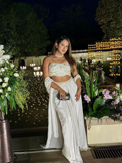 Dressed in timeless white to complement the royal affair at Rambagh Palace. Every detail, including my attire, is chosen to enhance the theme of your wedding.