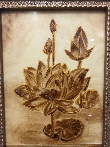 This elegant lotus flower, painted entirely with coffee, is a great example of the beautiful artwork created in our workshops. The student learned to create delicate shading and highlights to make the petals look three-dimensional.