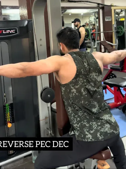 Day 28: Working on my rear deltoids with the reverse pec dec machine for a well-rounded shoulder workout.