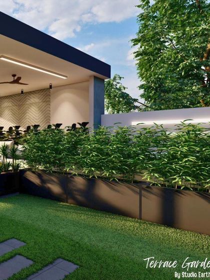 This render focuses on the green buffer we designed for a terrace. The built-in planters with dense bamboo create privacy and a lush backdrop for the modern seating area.