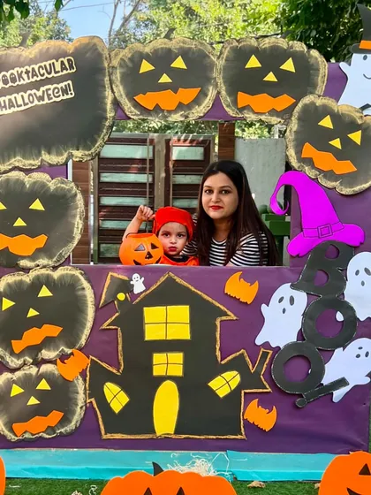 This little pumpkin and his mom are all smiles. Our family-friendly events are a core part of our school's culture.