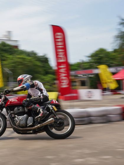 A motion-blur shot of a rider at the Chennai Zonal Selection, conveying the speed of the race.