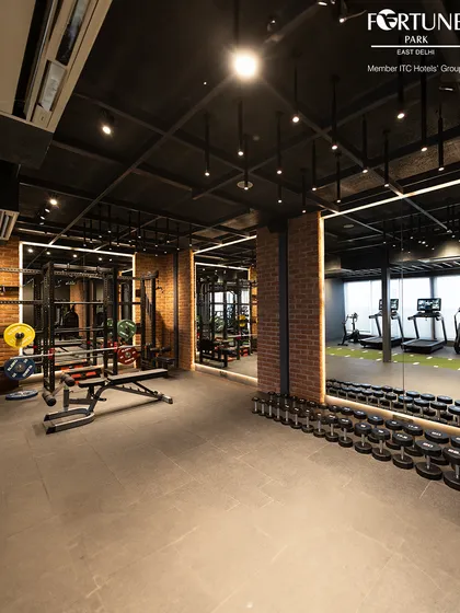 My 24-hour fitness center features a comprehensive free weights section with a full range of dumbbells and benches. The industrial chic design and spacious layout provide an motivating environment for your strength training workout.