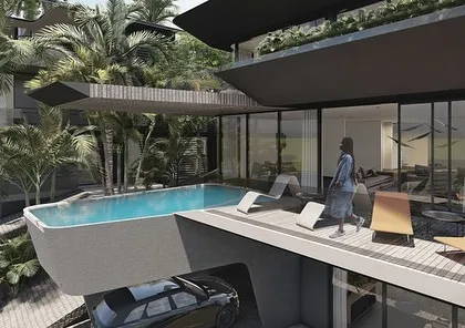 In the Dona Paula masterplan, cantilevered pools jut out from the terraced homes, adding to the dynamic feel of the architecture. This design choice maximizes views and creates a powerful visual connection between the private living space and the vast landscape beyond.
