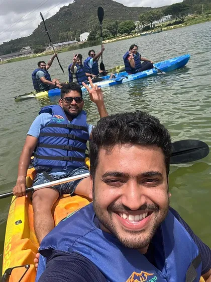 A happy selfie capturing the fun of kayaking with friends after a challenging trek.