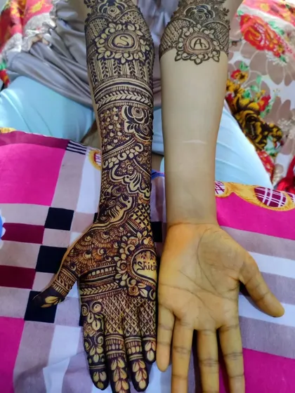 A unique before-and-after shot, showing one hand fully adorned with the personalized bridal henna.
