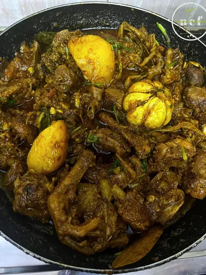 A close-up of my spicy duck curry, cooked until the meat is tender and falling off the bone.