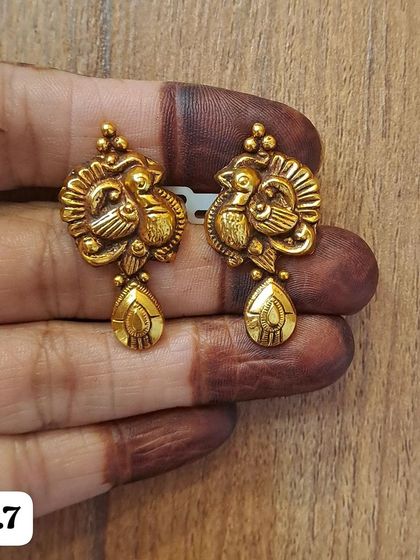 A delicate pair of peacock-themed earrings from my antique 92.5 silver collection. The small size makes them ideal for a subtle touch of tradition.
