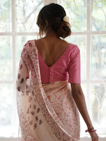 The Kāmini saree, crafted from dreamy silk chiffon, is a delicate floral beauty. It took 80 hours to create, using 20 different hand-carved vintage woodblocks to achieve its soft, flowing design.