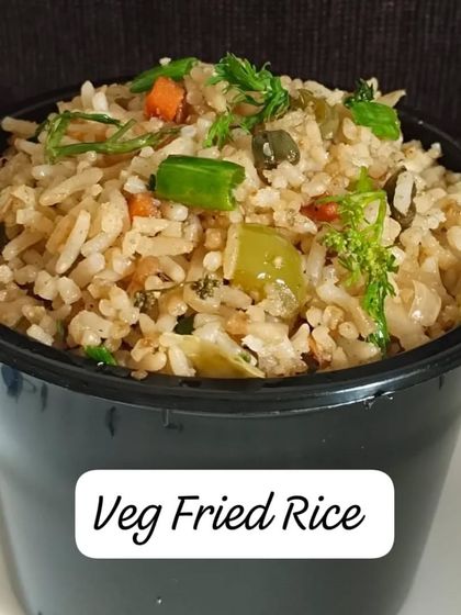 A single serving of my Veg Fried Rice, packed in a convenient bowl. It's loaded with fresh, chopped vegetables.