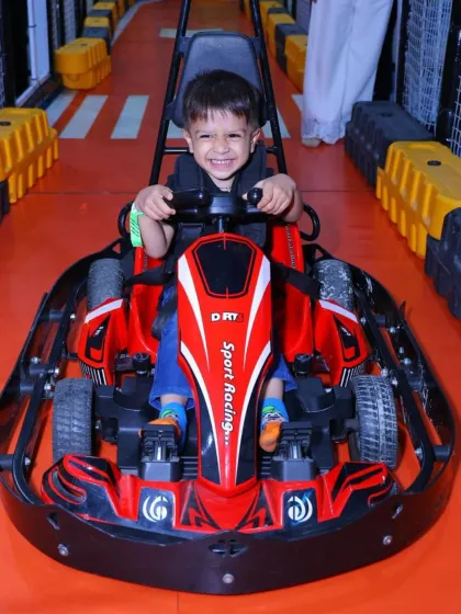 We love seeing the pure joy on our young racers' faces! Our kid-friendly electric go-karts offer a thrilling yet completely safe indoor racing experience on a dedicated track.