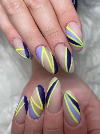 A bold graphic design with a matte nude base and intersecting stripes of purple, navy, and neon yellow.