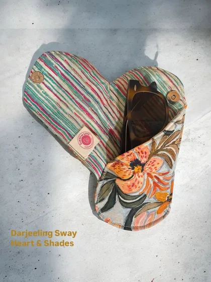 A heart-shaped cover for your sunnies. This lightweight sunglass holder from the Darjeeling Sway collection is easy to carry and lovely to look at.