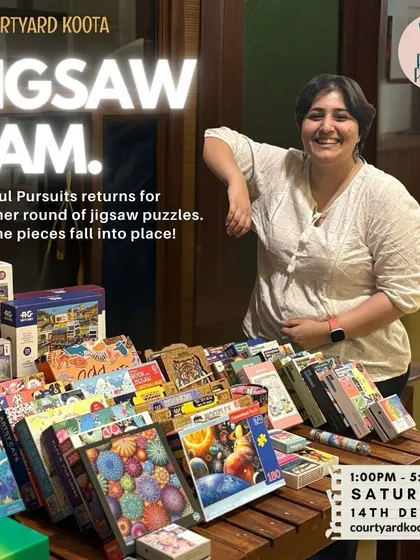Asma from Playful Pursuits, the puzzle queen who curates our Jigsaw Jam events, stands proudly with her collection of puzzles. Her passion brings joy to our community of puzzlers.