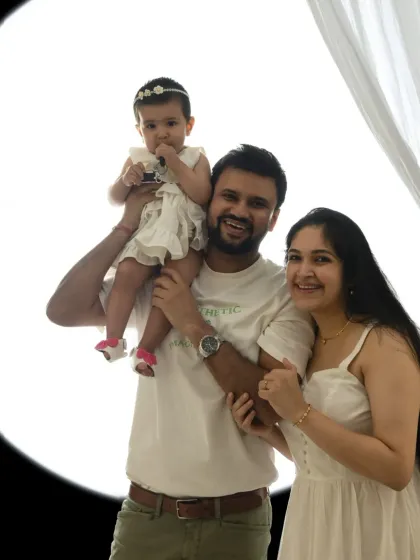A happy family portrait using a bright, circular light source. This technique creates a clean, high-key look that is full of joy.