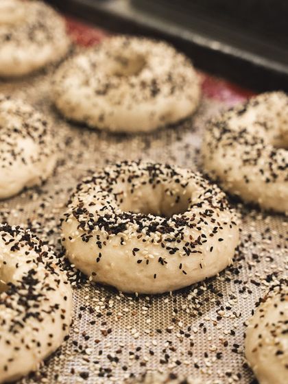 A close-up of our everything bagels before baking. The combination of seeds adds a wonderful texture and flavor.