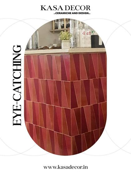 Eye-catching, geometric handmade tiles in shades of red used on a bar front. The varied tones and angular shapes create a dynamic and energetic surface.