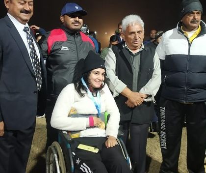Shriya Joshi stands with officials and supporters after her win at the Para National Archery Tournament. The support system of coaches, family, and the archery community is a vital part of our athletes' success.