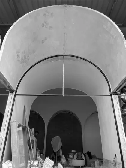 The vaults being assembled on-site. This image captures the scale of the prefabricated elements and the precision required to bring the design to life.