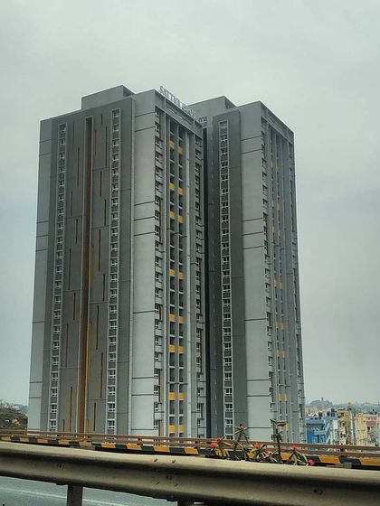 The Salarpuria Sattva apartment towers viewed from a distance, establishing their presence on the Bangalore skyline.