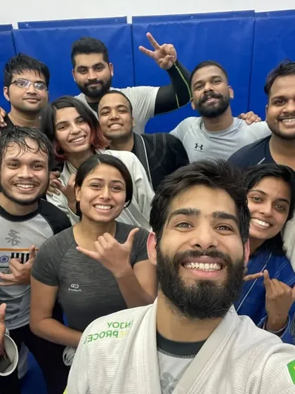A diverse group of students, all smiles after a session. This is a place where everyone belongs.