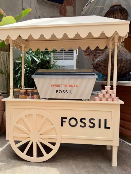 A custom-branded ice cream cart for the Fossil event served as both a functional treat station and a charming decor element. The neutral tones and clean branding aligned perfectly with Fossil's sophisticated aesthetic.