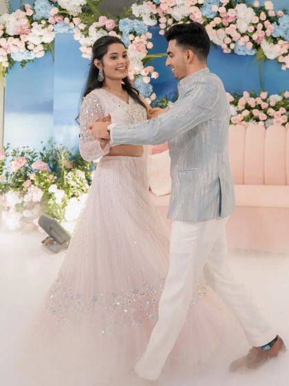 Yash and Sakshi share their first dance as an engaged couple. We created a dreamy atmosphere with low-lying fog and a backdrop of soft pastel florals, making their Roka ceremony feel truly magical.