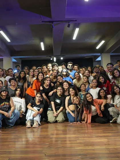 A group shot capturing the shared passion after a weekend of intense learning and dancing together.