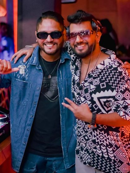 A picture with a fellow DJ, sharing a moment behind the decks.