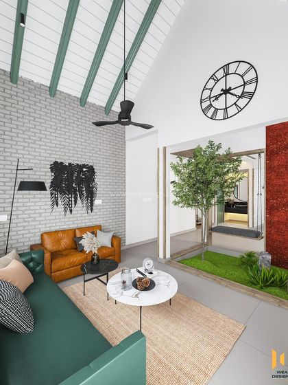 Another view of the upper living area, showing the large clock as a feature piece on the vaulted wall.