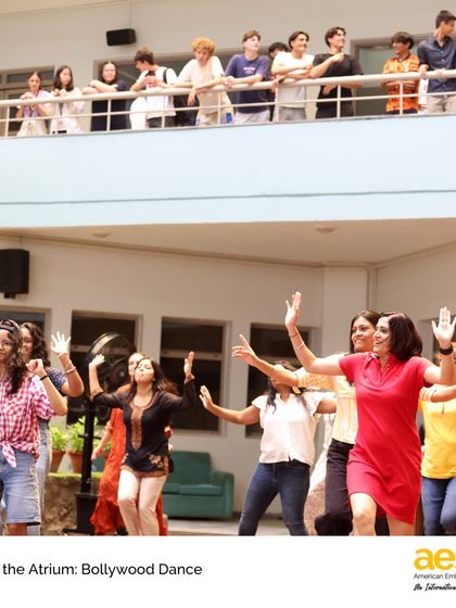 Students and faculty dance with joy during the Bollywood workshop. These events are designed to be inclusive and fun, encouraging everyone to participate regardless of their previous dance experience.