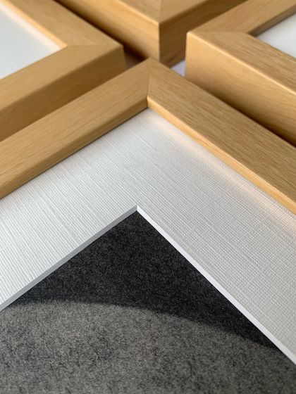 Our elegant maple frame is a versatile choice for showcasing art. Here, the light wood tone provides a soft, natural border for a series of black and white sketches.