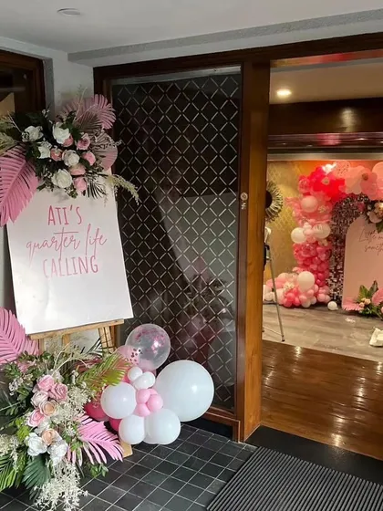 The welcome sign is the first thing your guests see. For this party, I designed a custom easel sign that matched the pink, floral, and tropical theme, giving guests a hint of the beautiful decor waiting inside.
