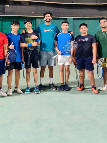 All smiles after a great training session. Our group classes are a great way to meet new people, find hitting partners, and push each other to get better.