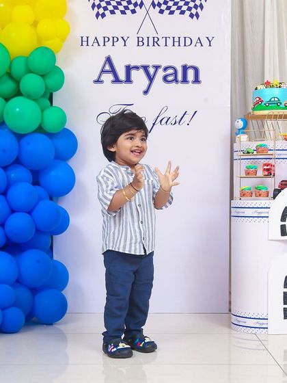 A vibrant 'Minions' themed birthday party, with yellow and blue decor, character cutouts, and fun props, creating a mischievous and joyful atmosphere.