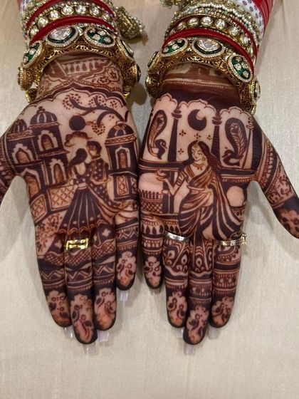 A full view of the Karwa Chauth story mehndi, showing the couple against a palace backdrop and the woman with the moon.