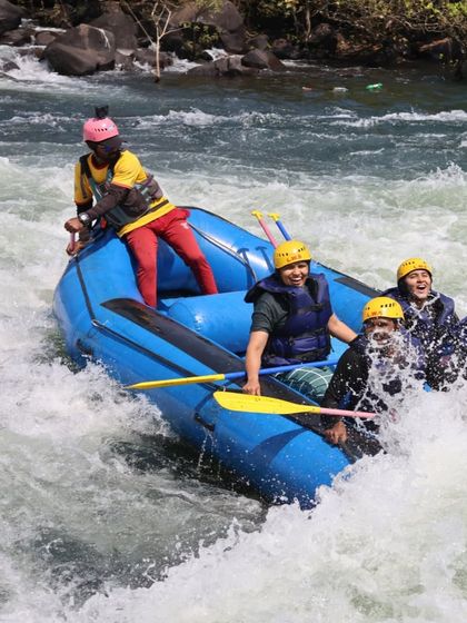 An action shot of our group navigating the rapids during a white water rafting session.