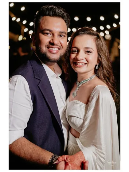 A happy portrait of the couple. Their smiles say it all. This look was about being comfortable, chic, and ready to celebrate with their closest family and friends.