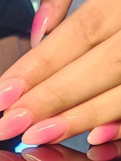 A soft and delicate pink ombre, fading from a sheer nude to a gentle baby pink at the tips.
