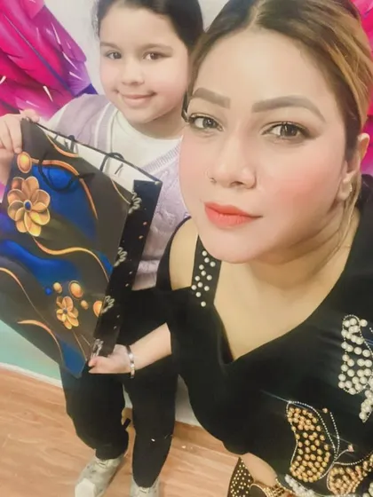 Posing with her well-earned gift, this student is a shining example of how dedication leads to success.