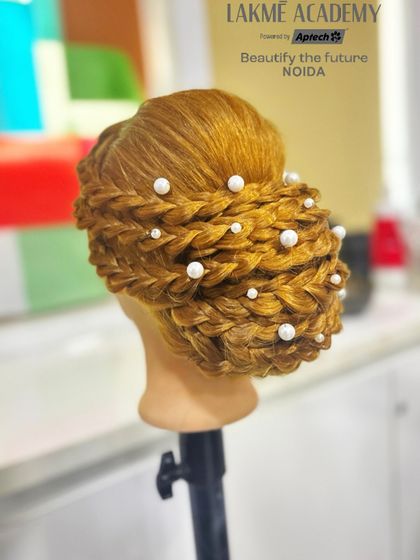 Another angle of this beautiful updo, showcasing the precision and creativity involved in its creation.