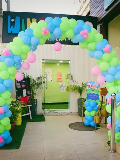 The entrance to a world of happiness! A colorful balloon arch welcomes guests to a fun-filled Peppa Pig party.