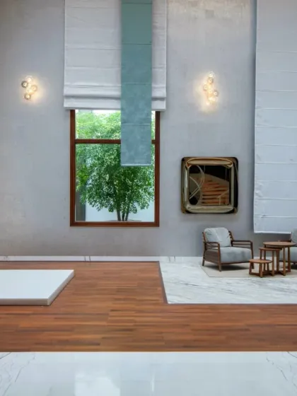 We design spaces for modern life and spiritual tranquility. This double-height room combines a serene pooja area with a minimalist lounge, using wood flooring to define the sacred space and elegant drapery to soften the grand scale.