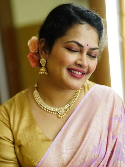 For another Diwali event, I styled Priyanka Barve in this soft, pastel pink Banarasi saree, paired with a classic gold blouse and pearl jewelry.