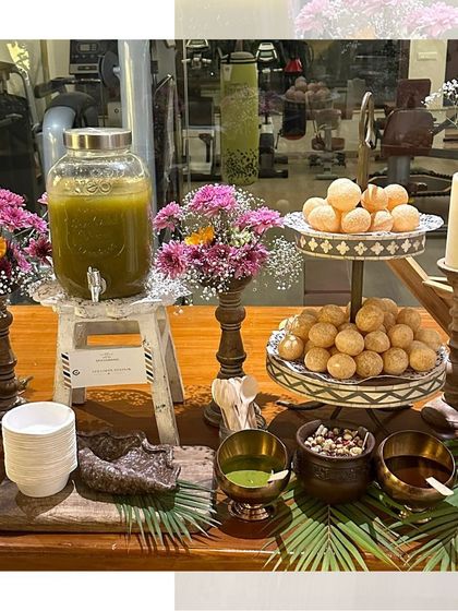 Our golgappe station is always a hit. Here it is set up with a two-tiered stand for the puris and beautiful floral arrangements.