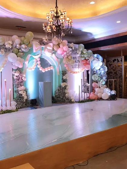 The empty stage before the event begins, beautifully lit and ready for the celebration. It’s a moment of calm before the magic happens.