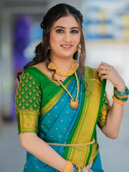 The complete look, showcasing the beautiful drape of the Paithani saree. The makeup is kept minimal and fresh to balance the richness of the attire.