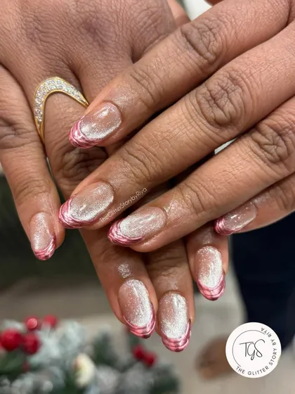 A unique French manicure featuring a shimmering cat-eye base with a textured, metallic pink chrome outline on the tips.
