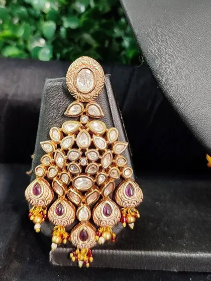 A unique earring design from my collection, featuring an antique finish and purple stone drops.